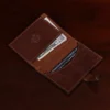 inside view of brown leather wallet with money and cards in pockets