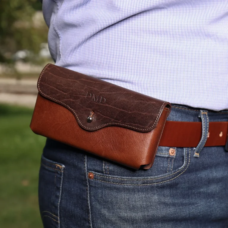 a man wearing the vintage brown and tobacco buffalo leather phone holster on his belt