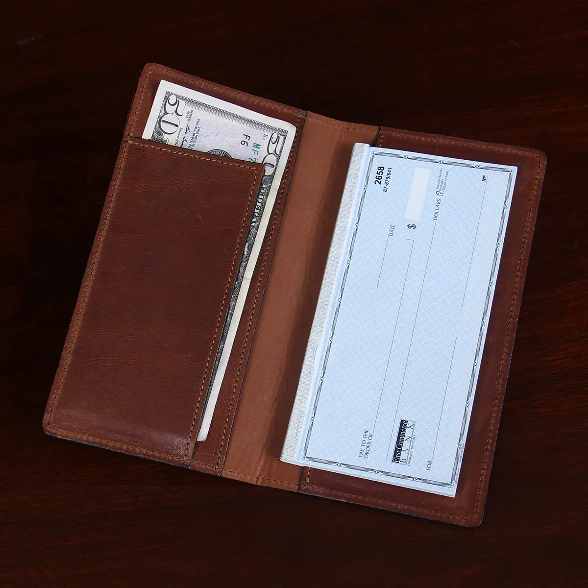 leather checkbook cover open view on table