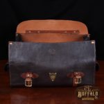 dark brown buffalo leather duffel bag on table - front view with flap open