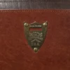 close up of the brass pommel shield with the serial number of the commander briefcase