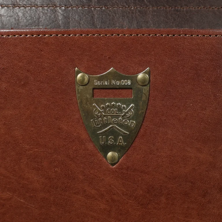close up of the brass pommel shield with the serial number of the commander briefcase