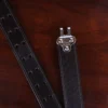 buffalo leather ranger belt with alligator trim sitting on wood table - hook view