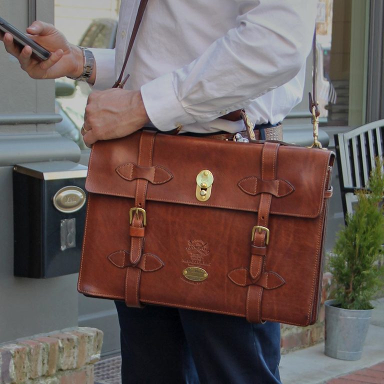 Man carrying No. 1943 Navigator Briefcase in Vintage Brown Steerhide Leather