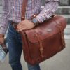 Man carrying No. 83 Book Bag in Vintage Brown