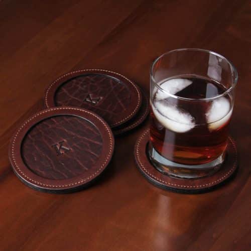 Tobacco Brown American Buffalo Leather Coasters on table with glass of tea
