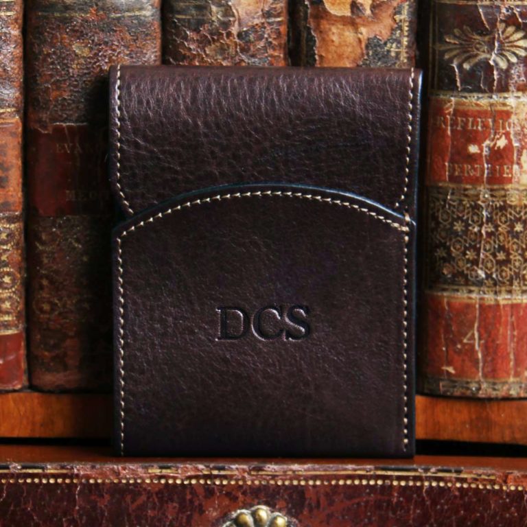 Dark brown american buffalo leather Front Pocket Wallet with fold-over flap - Front view on shelf in front of antique books