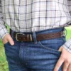 a man wearing the no 1 belt in tobacco brown american buffalo