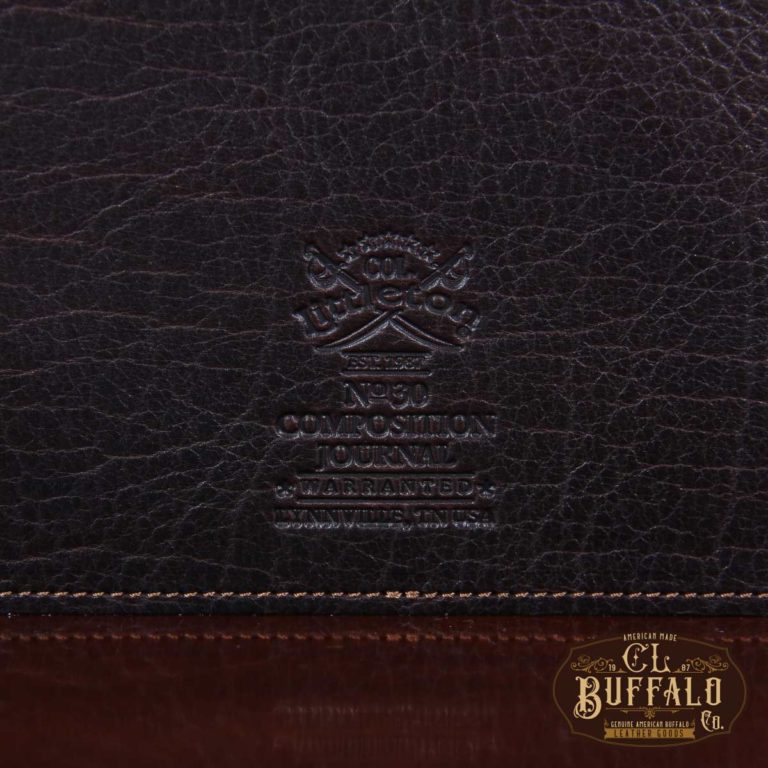 Dark drown buffalo leather composition journal cover - detail view of logo stamp