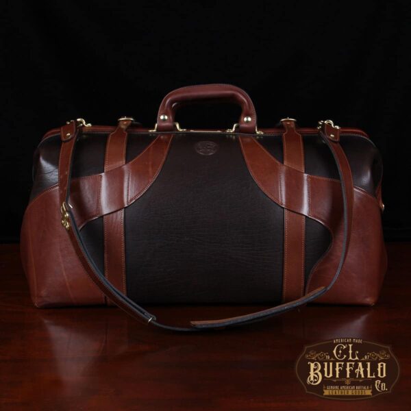 Vintage-style Gladstone dark brown american buffalo leather No. 5 Grip travel bag on wooden table - back view