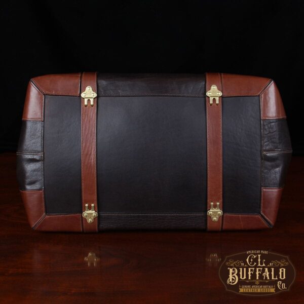 Vintage-style Gladstone dark brown american buffalo leather No. 5 Grip travel bag on wooden table - bottom view