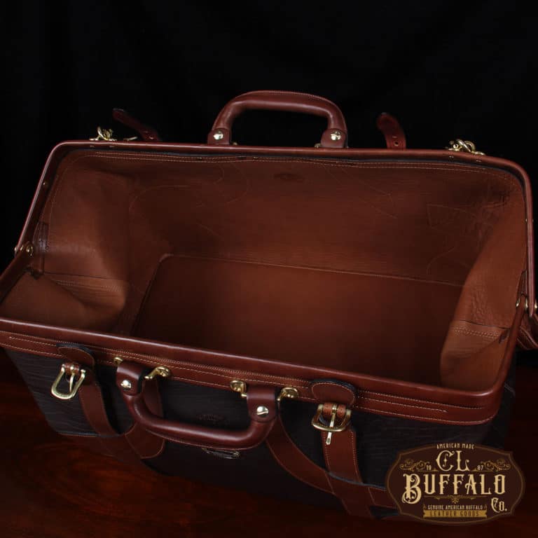 Vintage-style Gladstone dark brown american buffalo leather No. 5 Grip travel bag on wooden table - view of inside of empty bag