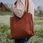 No. 9B Tote Bag made of Vintage Brown Steerhide leather worn crossbody on woman