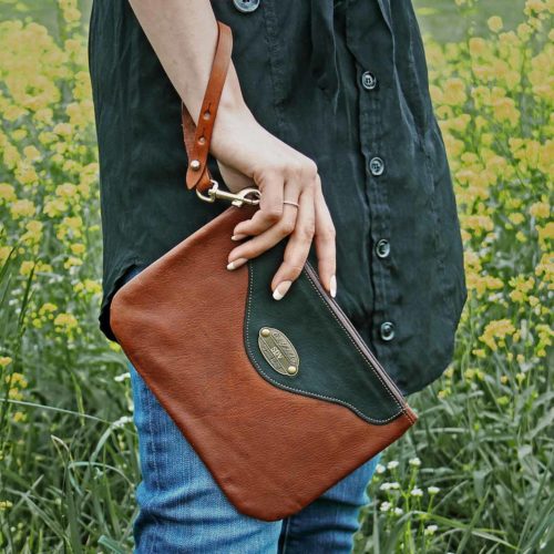 Leather vintage brown wristlet on woman in field