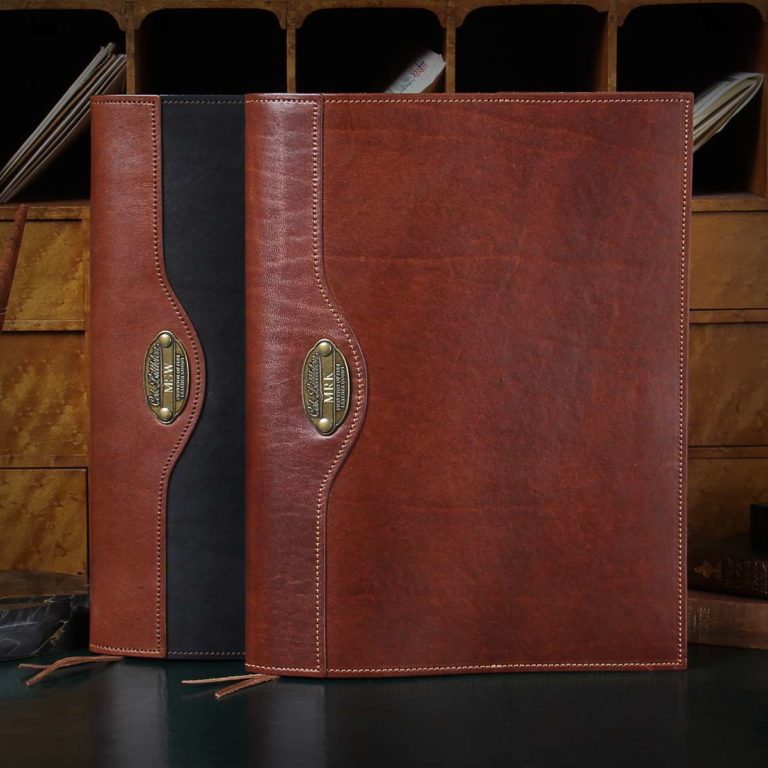 2 leather journals the right one is black with vintage brown trim and the one on the right is all vintage brown