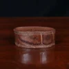 cuff-bracelet-alligator-no28-front view- on a wooden table with a dark background