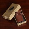 Brown Leather American Alligator Lip Balm Holder - cardboard box packaging with leather wrapped around lip balm holder inside