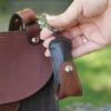 Woman clipping Tobacco Brown American Buffalo Lip Balm Holder