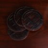 Round leather coasters in Brown American Alligator - set of 4 - ID 001 - top view of 4 coasters fanned out in a stack on black background