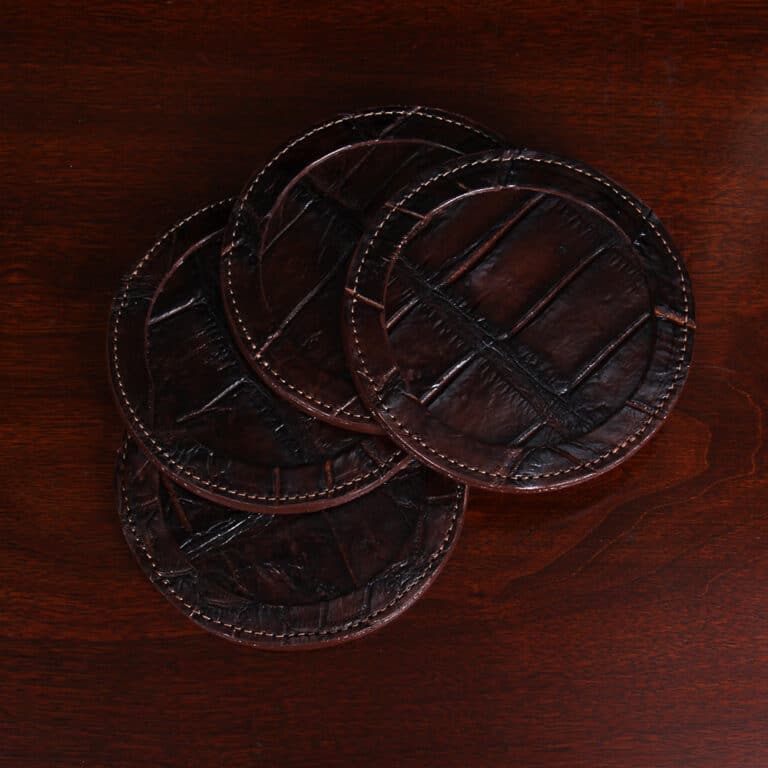 Round leather coasters in Brown American Alligator - set of 4 - ID 001 - top view of 4 coasters fanned out in a stack on black background