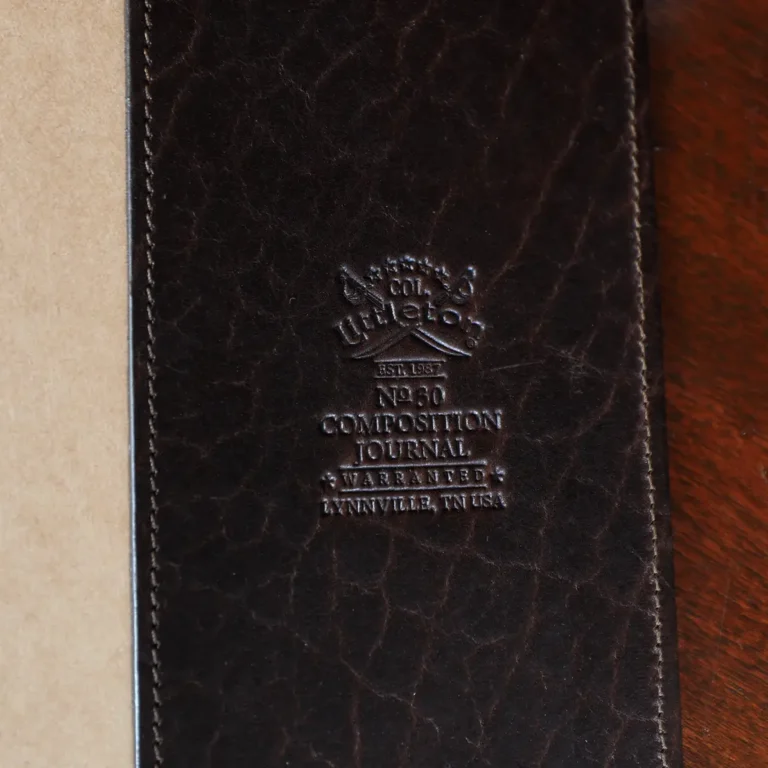 No. 30 Composition Journal in Vintage Brown American Alligator - ID 001 - open view of logo on a black background