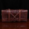 No. 1 Grip Travel Duffel Bag in Vintage Brown American Alligator - serial number 009 - bottom view showing criss-crossed support straps