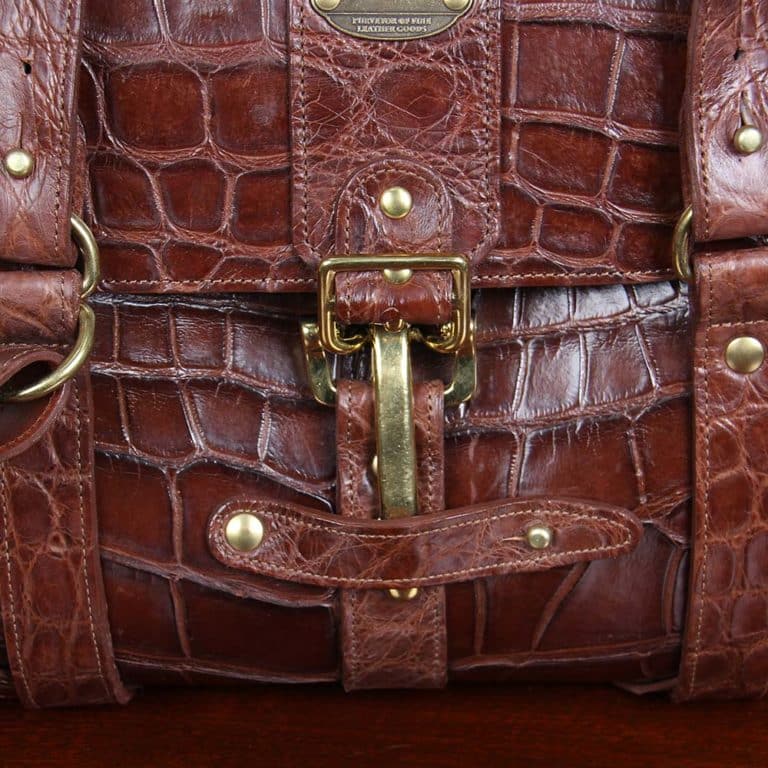No. 1 Grip Travel Duffel Bag in Vintage Brown American Alligator - serial number 009 - detail view of brass cinch buckle closure