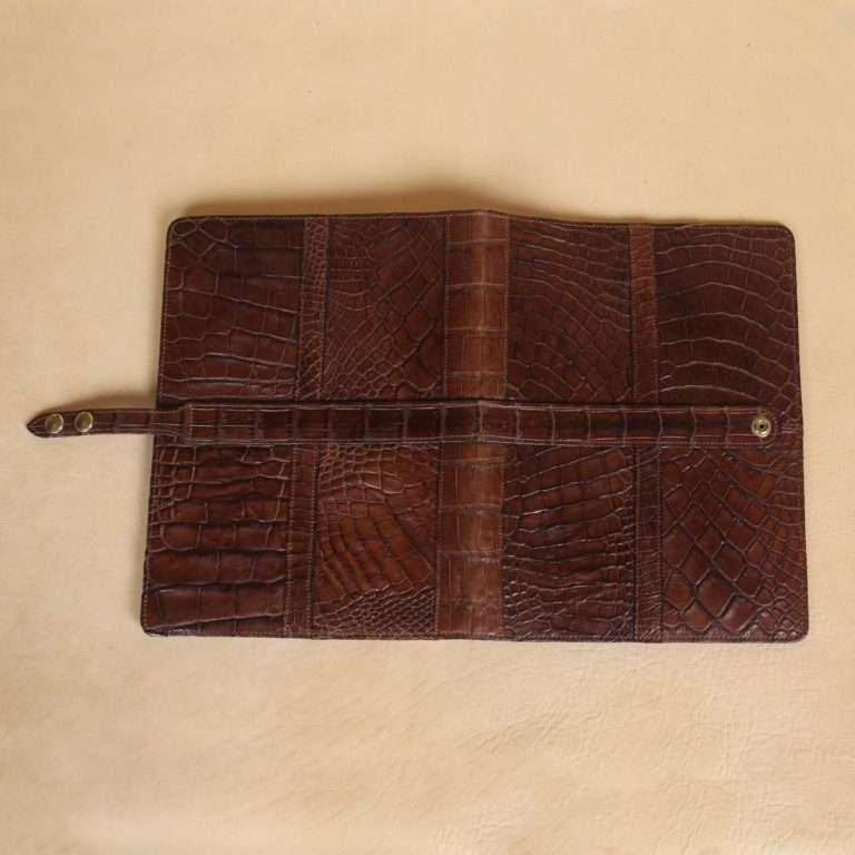 front and back view of brown american alligator leather portfolio on cream background