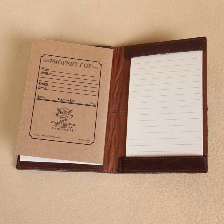 inside view of small brown american alligator leather journal cover on cream background