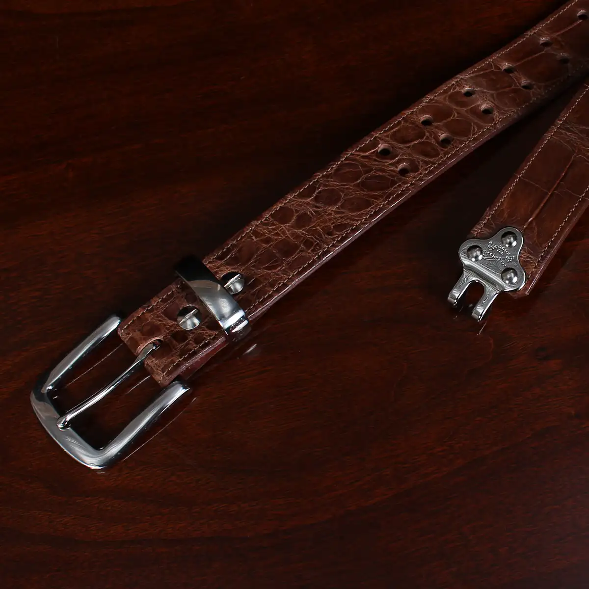 No. 4 Belt in brown American Alligator and silver buckle - ID 002 - hook view on black background