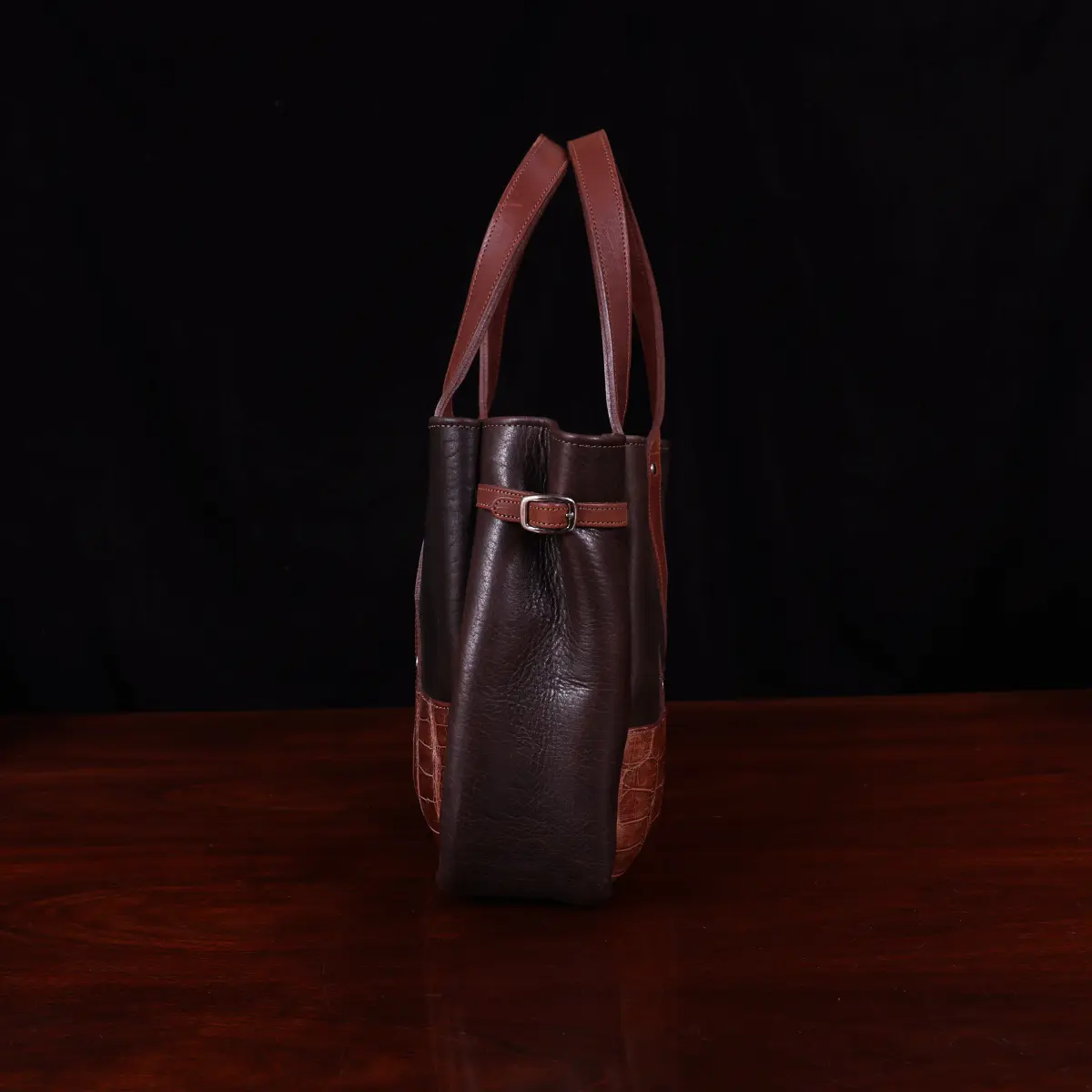 Leather Bentley Tote in dark Tobacco Brown American Buffalo trimmed with American Alligator and Vintage Brown Steerhide - side View on black background