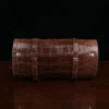 CL - No. 2 Shave Dopp Kit in Vintage Brown American Alligator with No. 8 Khaki Cotton Canvas Lining - Serial Number 002 - back rolled view on a wooden table