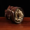 CL - No. 2 Shave Dopp Kit in Vintage Brown American Alligator with No. 8 Khaki Cotton Canvas Lining - Serial Number 002 - rolled view on a wooden table