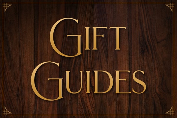 "Gift Guides" in gold text on a wood background
