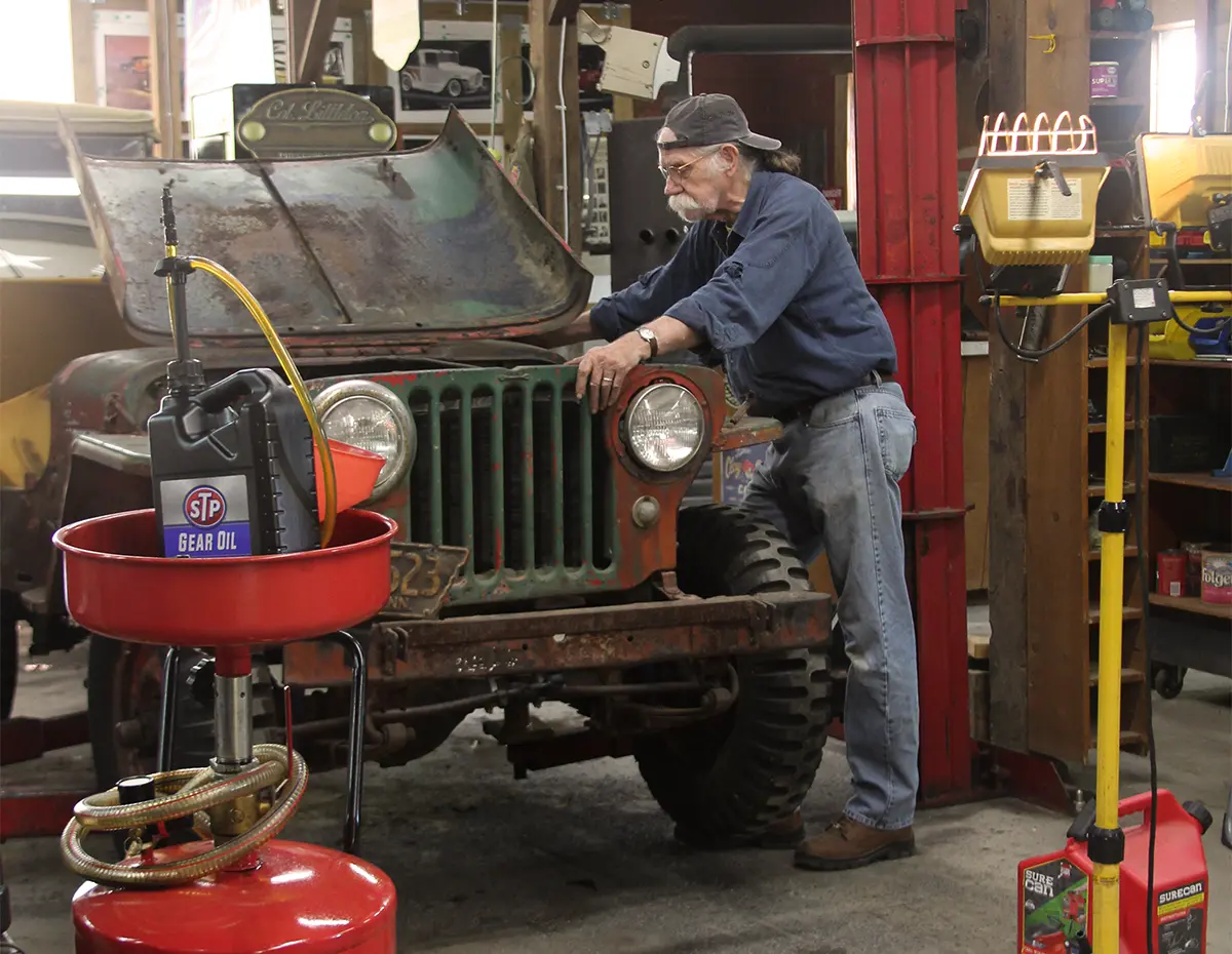 Colonel working in the hot rod garage