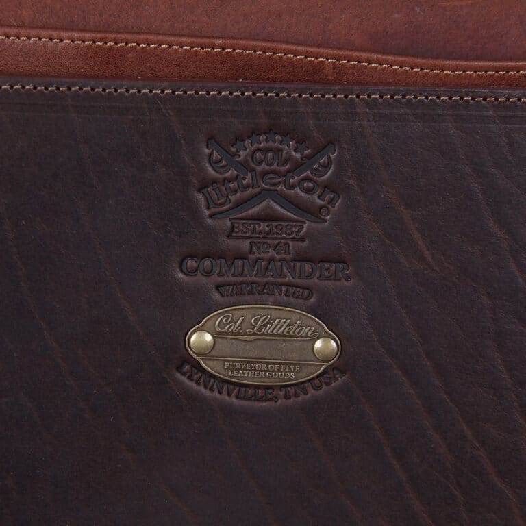 No. 41 Commander Briefcase in dark Tobacco Brown American Buffalo with Vintage Brown American Steerhide trim and American Alligator flap - serial number 008 - detail view of Col. Littleton logo stamp and personalization plate