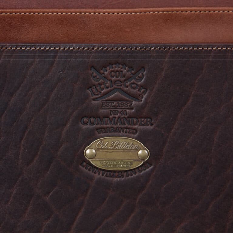 No. 41 Commander Briefcase in dark Tobacco Brown American Buffalo with Vintage Brown American Steerhide trim and American Alligator flap - serial number 009 - detail view of Col. Littleton logo stamp and personalization plate