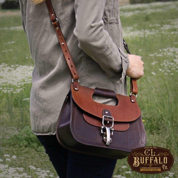 No. 17 Hunt Bag made of two-tone brown American Buffalo and Vintage Brown Steerhide leather worn crossbody on woman