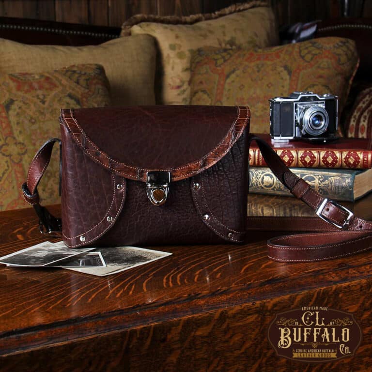 buffalo leather crossbody box bag on table