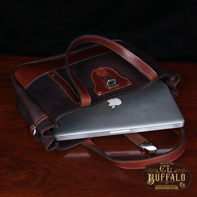 Bentley Tote in dark Tobacco Brown American Buffalo with contrasting vintage brown American Steerhide Trim - open view of the bag on its side with a MacBook laptop coming out