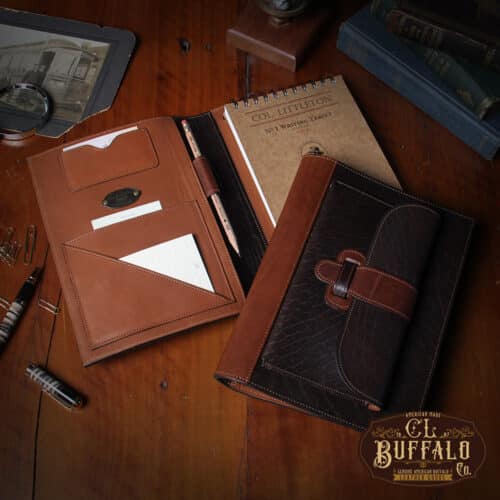 No. 1 Steno Padfolio in Tobacco Brown American Buffalo with Vintage Brown Steerhide Trim - 2 notebooks on a wooden table with the bottom one open and the top one closed