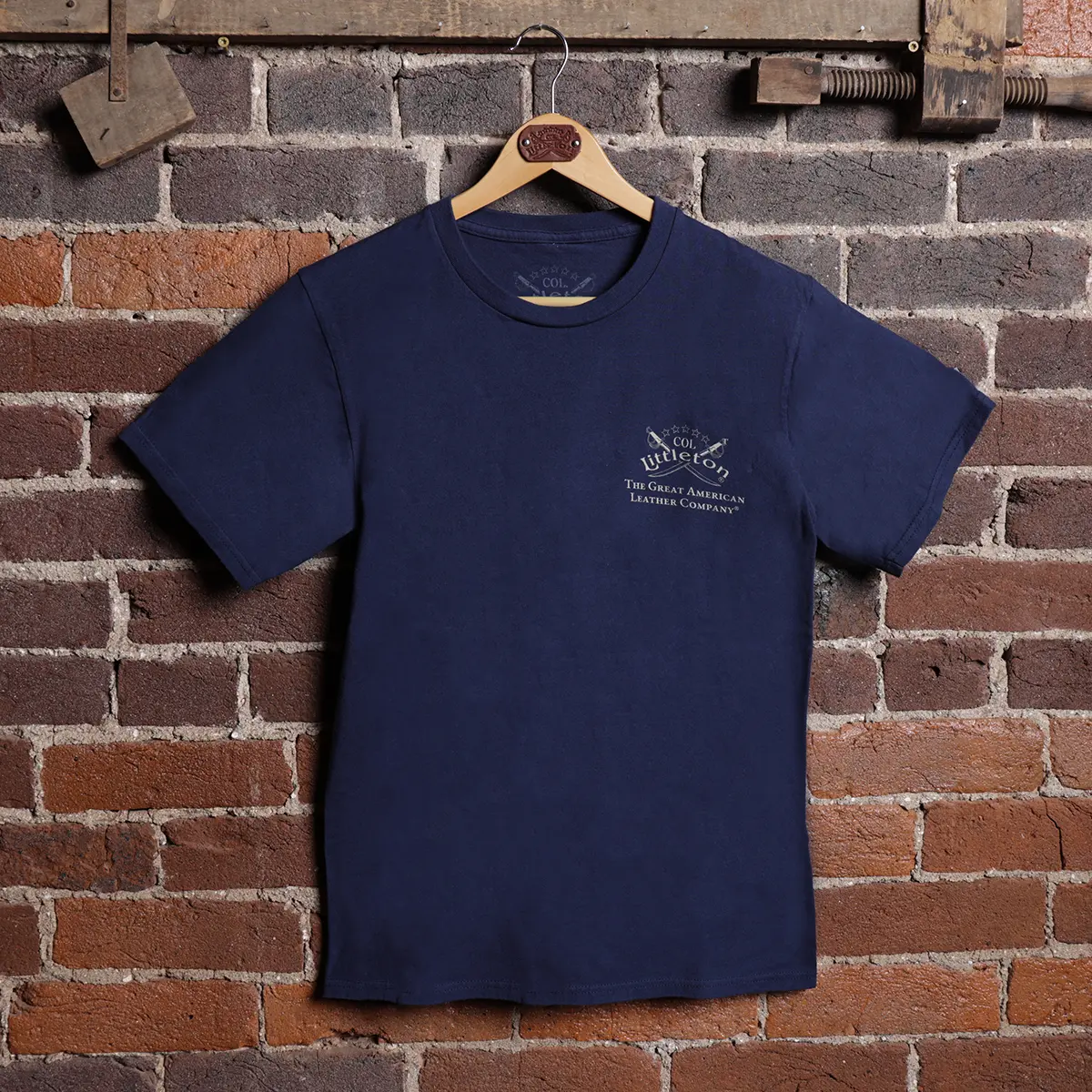 Front of a navy colonel littleton tshirt