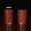 can of coke inside of brown leather can caddies with personalized initial stamp