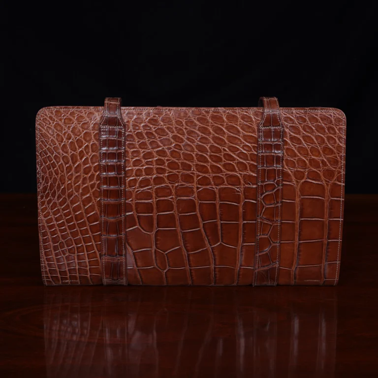 No.18 legal portfolio in alligator front view - id 001- on wooden table with black background