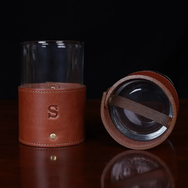leather veranda glass sleeve and glass on wooden table with dark background - front and bottom view
