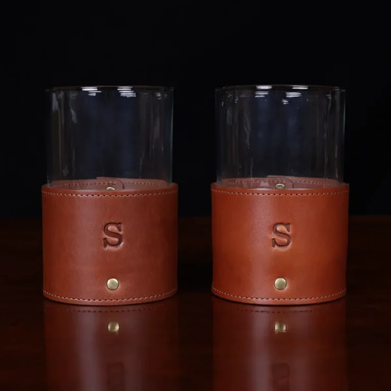 leather veranda glass sleeve and glass on wooden table with dark background - front and front view