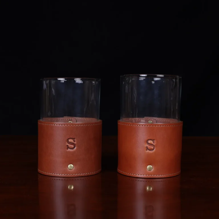 leather veranda glasses sleeve and glass on wooden table with dark background - set of two