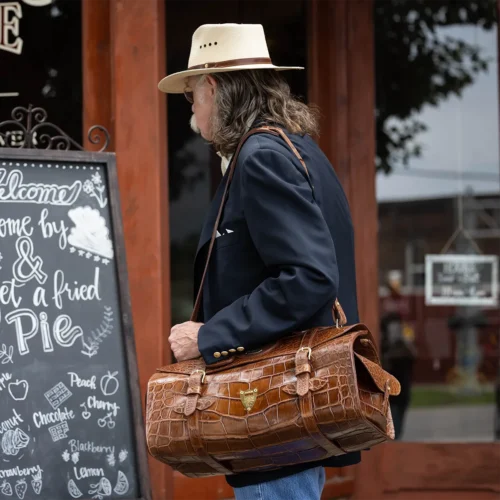 colonel standing in front of pie shop outside with no 2 alligator grip
