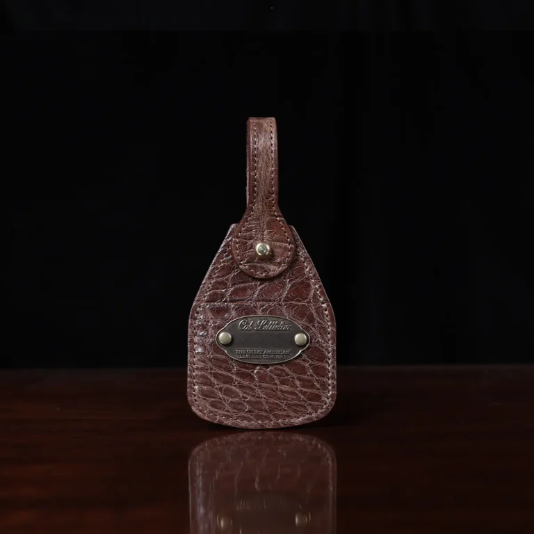 no 5 grip in steerhide with brown american alligator trim - front view of luggage tag - on a wood table with black background - ID 002