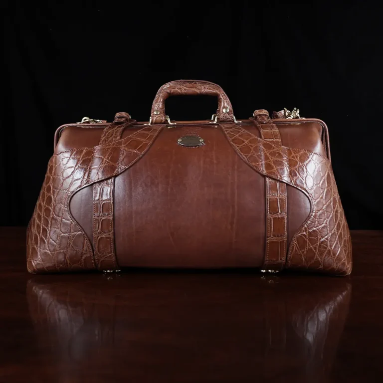 no 5 grip in steerhide with brown american alligator trim - front view - on a wood table with black background - ID 002